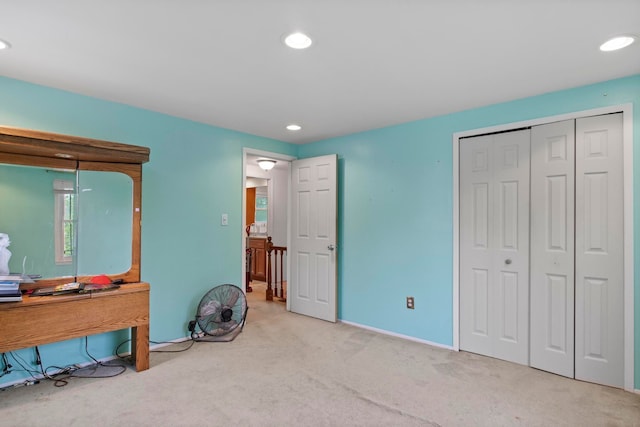 bedroom with carpet flooring, a closet, recessed lighting, and baseboards