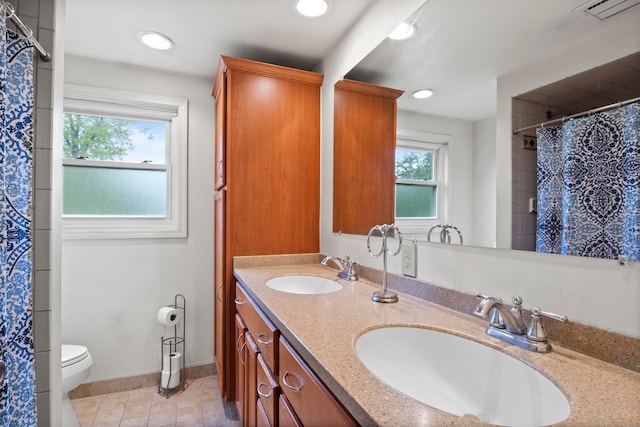 bathroom with toilet, double vanity, tile patterned floors, a shower with shower curtain, and recessed lighting