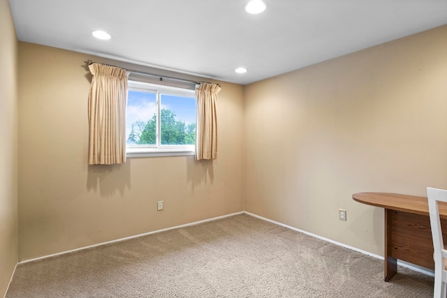 unfurnished office featuring carpet, baseboards, and recessed lighting