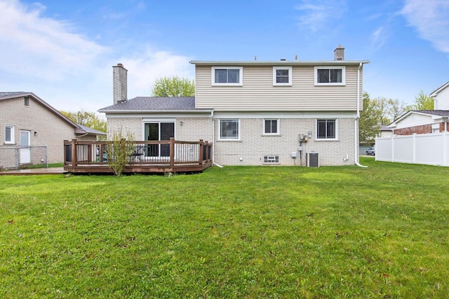 rear view of property featuring a chimney, a wooden deck, brick siding, and cooling unit