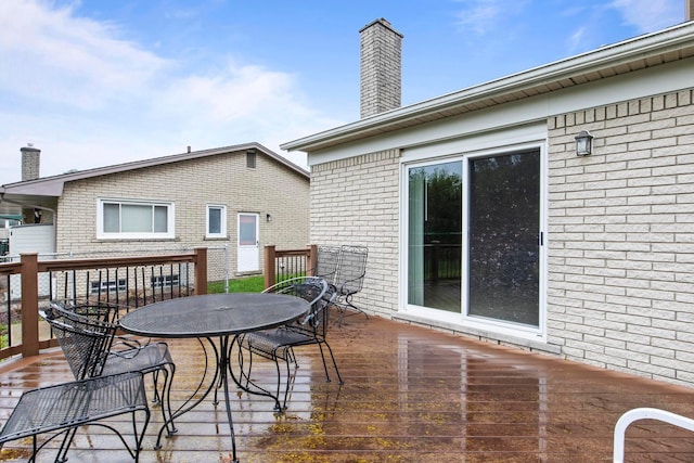 deck featuring outdoor dining area