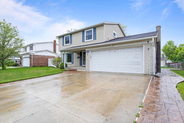 traditional home featuring brick siding, a chimney, a front yard, concrete driveway, and a garage