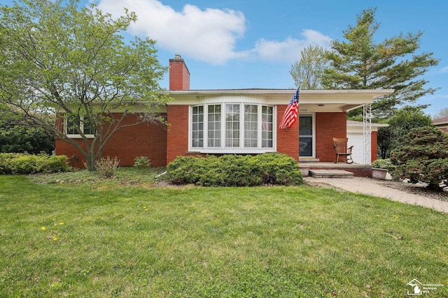 2330 Ashby St, Trenton, MI 48183 - ranch-style home featuring brick siding, a front yard, a chimney, and covered porch