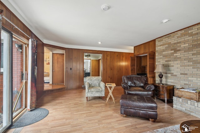 2330 Ashby St, Trenton, MI 48183 - living room featuring wooden walls and light wood-style floors
