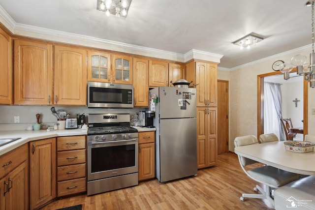 2330 Ashby St, Trenton, MI 48183 - kitchen with stainless steel appliances, ornamental molding, light wood-type flooring, light countertops, and glass insert cabinets