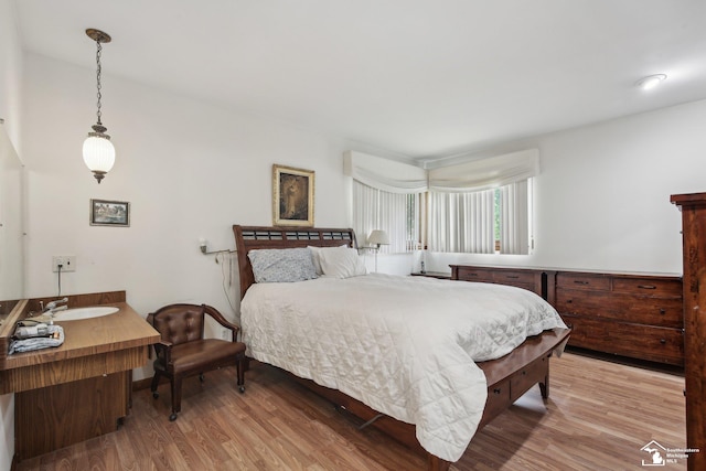 2330 Ashby St, Trenton, MI 48183 - bedroom with light wood-style flooring