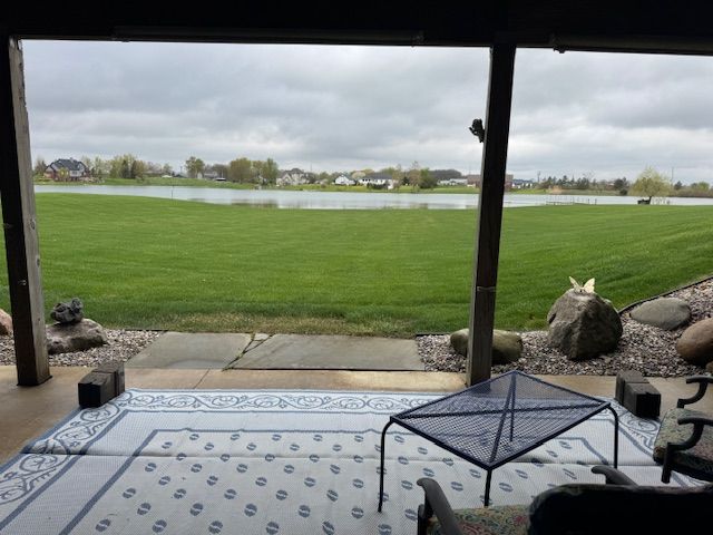 2660 Bay Pt, Imlay City, MI 48444 - view of patio featuring a water view
