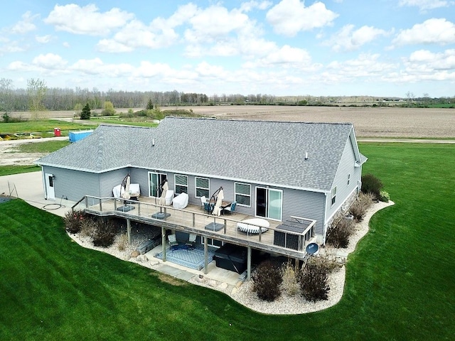 2660 Bay Pt, Imlay City, MI 48444 - rear view of house featuring a shingled roof, a lawn, and a wooden deck