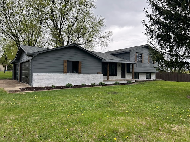 split level home with brick siding, a garage, a shingled roof, and driveway