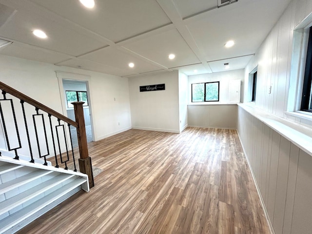 basement with wood finished floors, recessed lighting, stairway, and baseboards