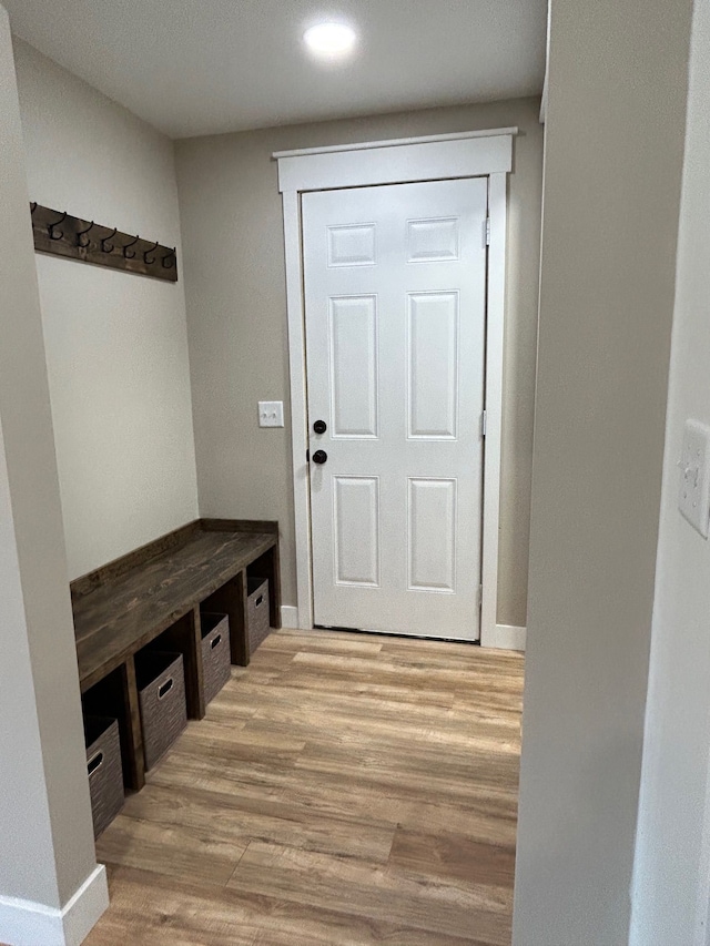 mudroom with light wood-type flooring, baseboards, and recessed lighting