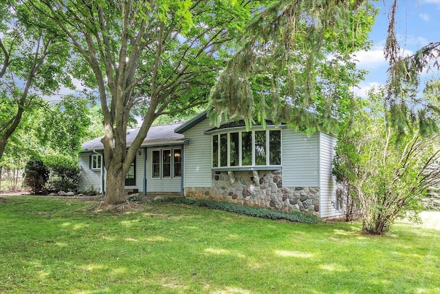 1273 Little John Lake Rd, Allegan, MI 49010 - view of front of property with a front lawn and stone siding