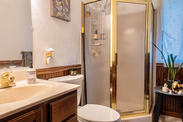 1273 Little John Lake Rd, Allegan, MI 49010 - bathroom featuring toilet, a shower stall, vanity, and a textured wall