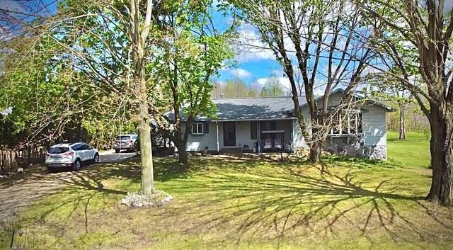 1273 Little John Lake Rd, Allegan, MI 49010 - ranch-style house featuring a front yard and roof with shingles
