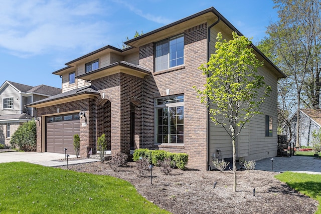 view of front facade featuring driveway and brick siding