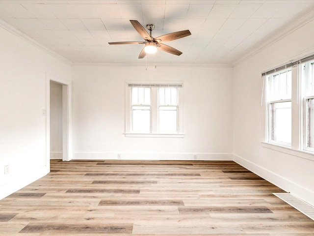1308 10th St, Port Huron, MI 48060 - empty room featuring ornamental molding, ceiling fan, light wood-style floors, and baseboards