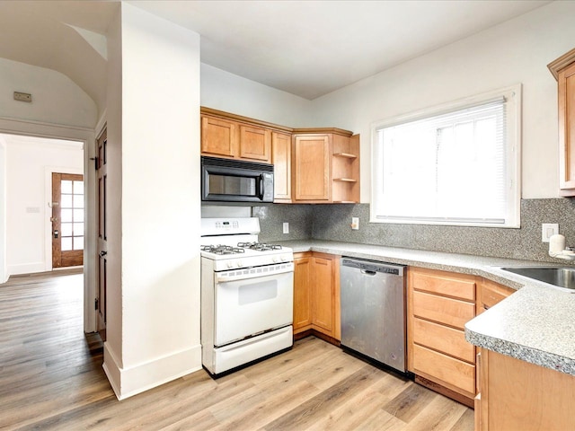 1308 10th St, Port Huron, MI 48060 - kitchen featuring black microwave, dishwasher, white range with gas cooktop, a sink, and light wood-style flooring