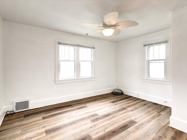 1308 10th St, Port Huron, MI 48060 - unfurnished room with healthy amount of natural light, ceiling fan, and baseboards
