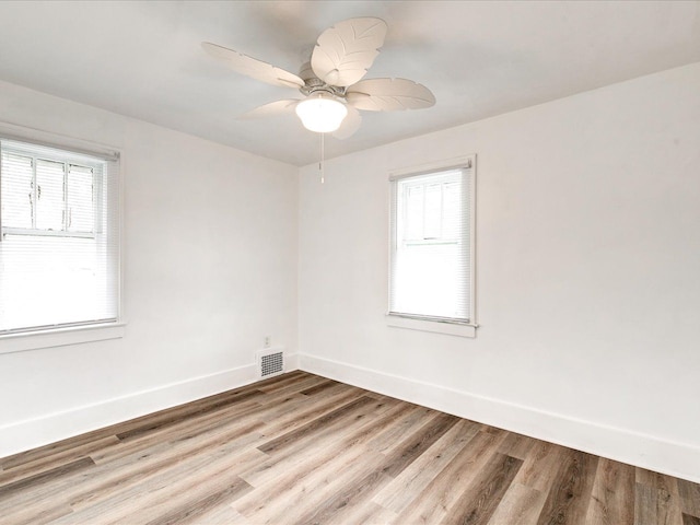 1308 10th St, Port Huron, MI 48060 - unfurnished room featuring baseboards, wood finished floors, and ceiling fan