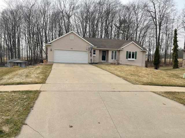 ranch-style home featuring a garage, concrete driveway, and a front lawn