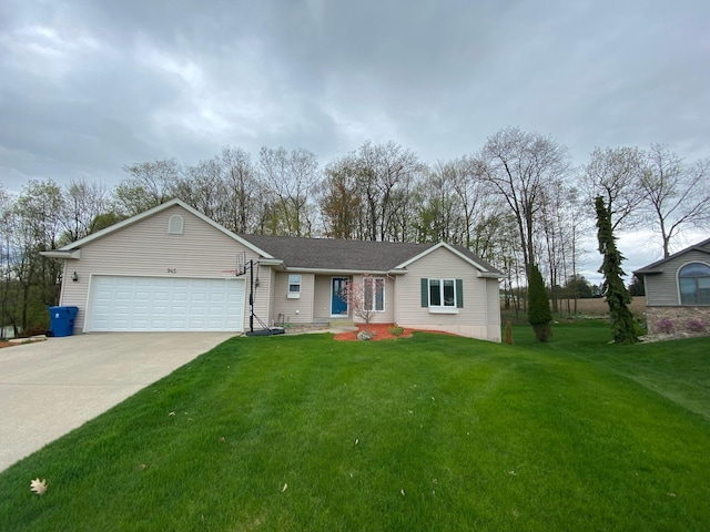 945 Valley Ave, Fremont, MI 49412 - ranch-style house with a garage, driveway, and a front yard