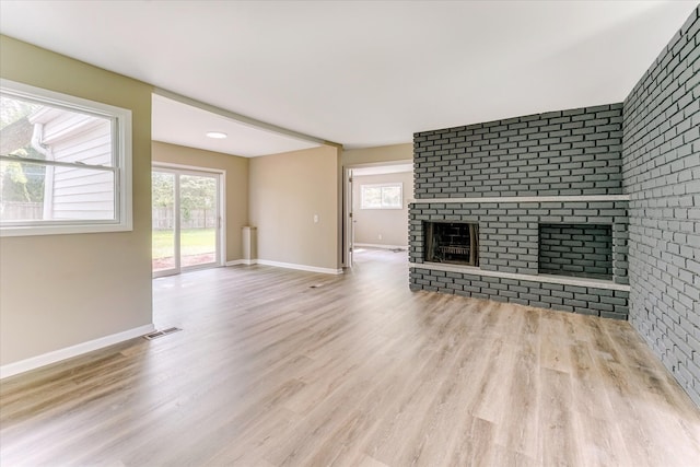 2365 Middlebelt Rd, West Bloomfield, MI 48324 - unfurnished living room with wood finished floors, a fireplace, and baseboards
