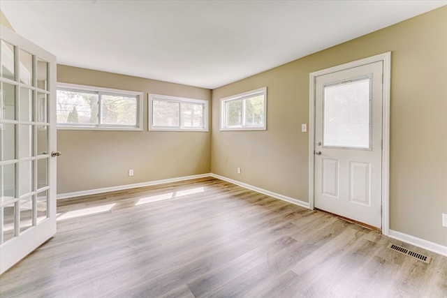 2365 Middlebelt Rd, West Bloomfield, MI 48324 - empty room with light wood finished floors and baseboards