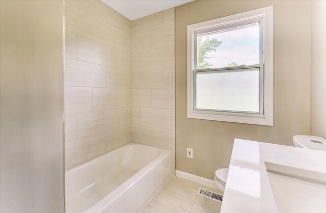 2365 Middlebelt Rd, West Bloomfield, MI 48324 - full bath featuring toilet, baseboards, tile patterned floors, and shower / washtub combination