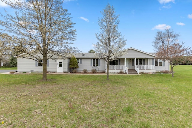 880 W Ave, Big Rapids, MI 49307 - ranch-style home featuring a porch and a front lawn