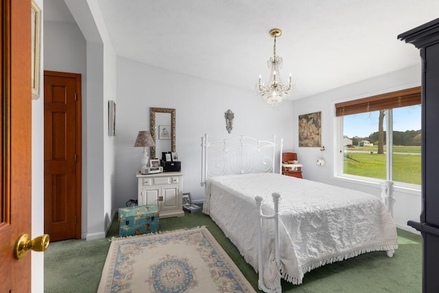 880 W Ave, Big Rapids, MI 49307 - carpeted bedroom featuring a chandelier and baseboards