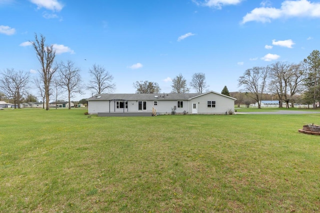 880 W Ave, Big Rapids, MI 49307 - back of house with a yard