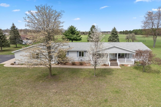 880 W Ave, Big Rapids, MI 49307 - view of front of property with covered porch and a front lawn