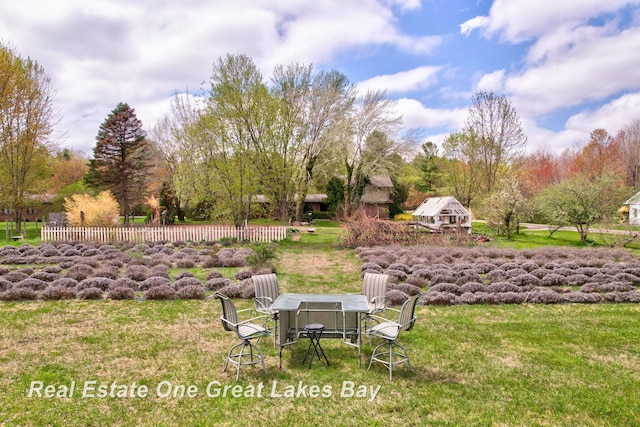 view of yard featuring outdoor dining space