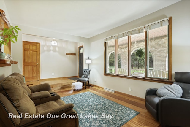 living room with wood finished floors and baseboards