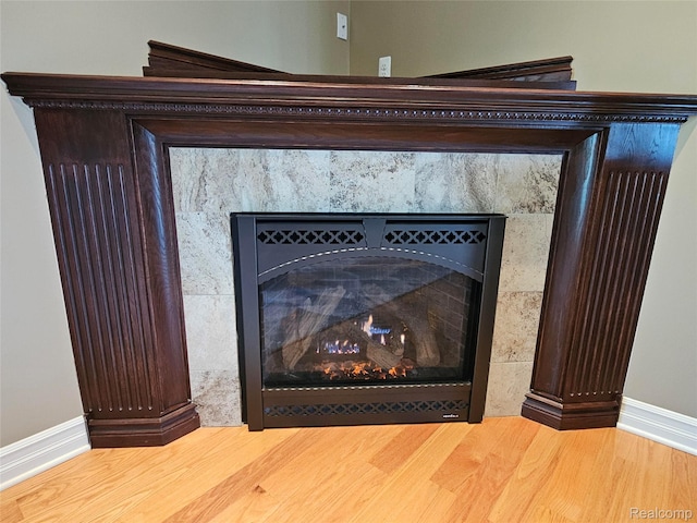6100 30 Mile Rd, Washington, MI 48095 - detailed view of a premium fireplace, wood finished floors, and baseboards