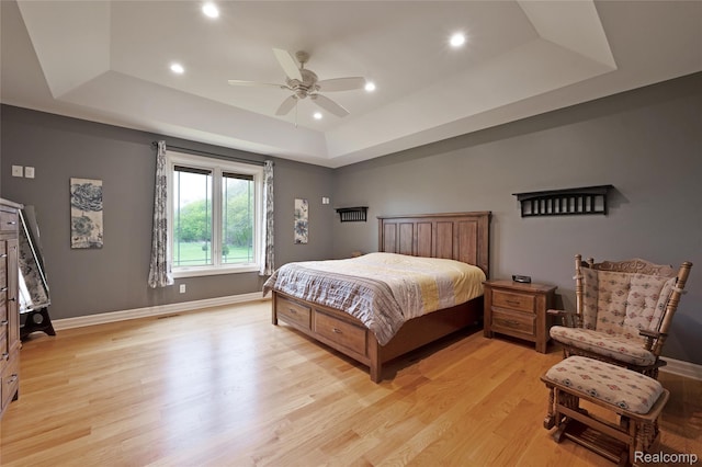 6100 30 Mile Rd, Washington, MI 48095 - bedroom featuring a tray ceiling, light wood-style floors, recessed lighting, baseboards, and ceiling fan