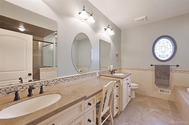 6100 30 Mile Rd, Washington, MI 48095 - full bath featuring vanity, a bath, tile walls, toilet, and tile patterned floors