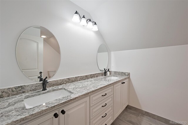 6100 30 Mile Rd, Washington, MI 48095 - full bathroom featuring vaulted ceiling, double vanity, and tile patterned flooring