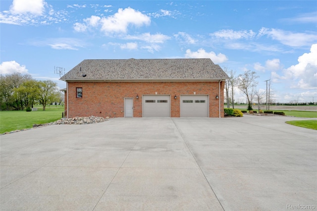6100 30 Mile Rd, Washington, MI 48095 - view of home's exterior featuring driveway, brick siding, a lawn, and a garage