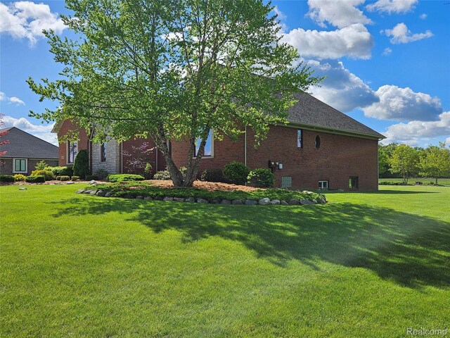 6100 30 Mile Rd, Washington, MI 48095 - view of home's exterior with a lawn and brick siding