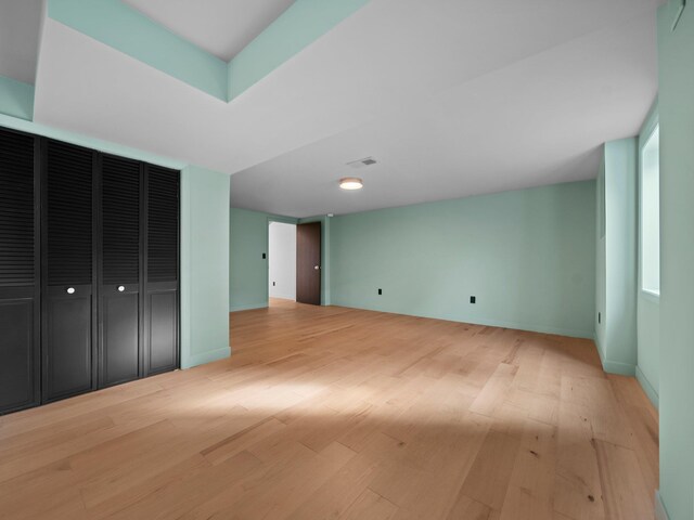1330 N Orchard Dr, Traverse City, MI 49686 - unfurnished bedroom with light wood-type flooring and baseboards