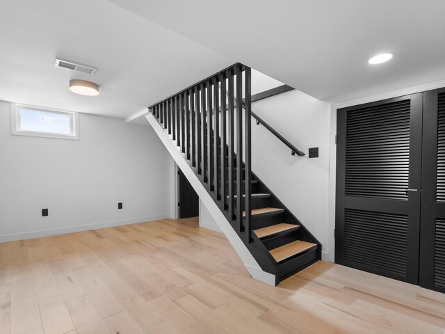 1330 N Orchard Dr, Traverse City, MI 49686 - staircase with wood finished floors, baseboards, and recessed lighting