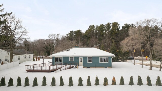 1330 N Orchard Dr, Traverse City, MI 49686 - snow covered house with a deck