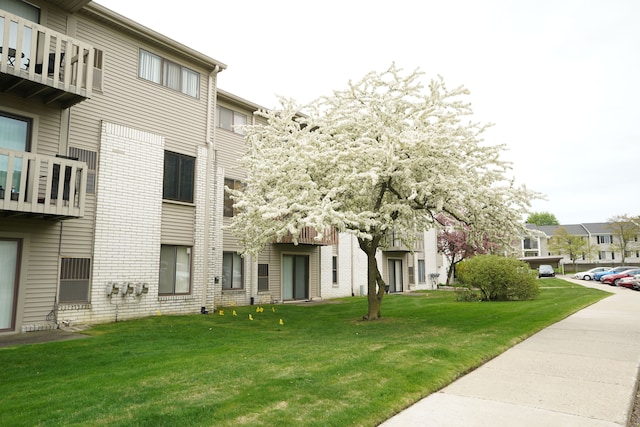 surrounding community featuring a lawn