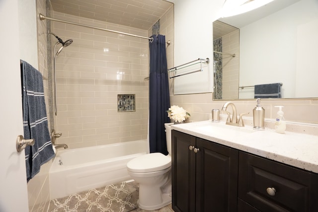 bathroom featuring shower / bath combo, toilet, and vanity