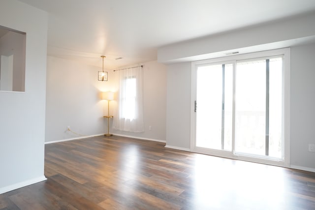 32013 W 12 Mile Rd Unit 306, Farmington Hills, MI 48334 - spare room with dark wood finished floors and baseboards