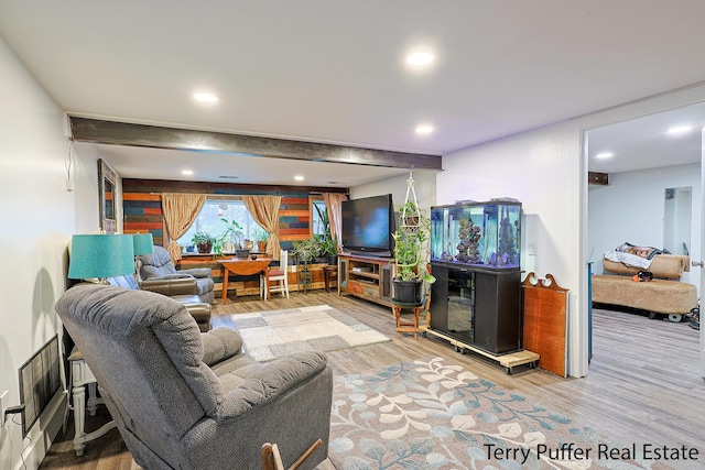 living room with wood finished floors and recessed lighting