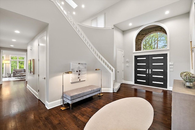 31080 Lucerne Dr, Franklin, MI 48025 - entryway featuring a towering ceiling, wood finished floors, baseboards, recessed lighting, and stairs