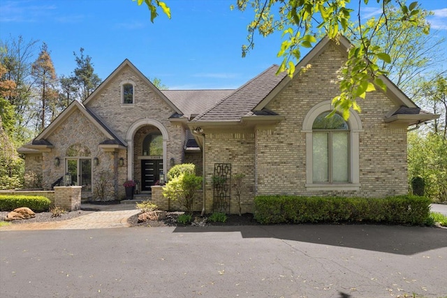 31080 Lucerne Dr, Franklin, MI 48025 - french country home with brick siding and roof with shingles