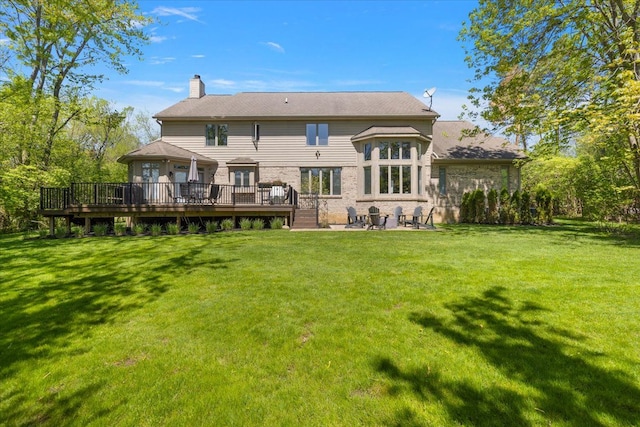 31080 Lucerne Dr, Franklin, MI 48025 - back of house featuring a chimney, a deck, a lawn, and a patio